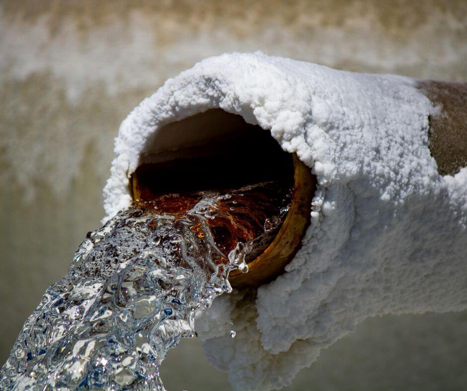 Closeup of snow and ice covered pipe