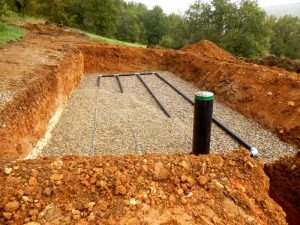 Photo of septic field dug out with pipes
