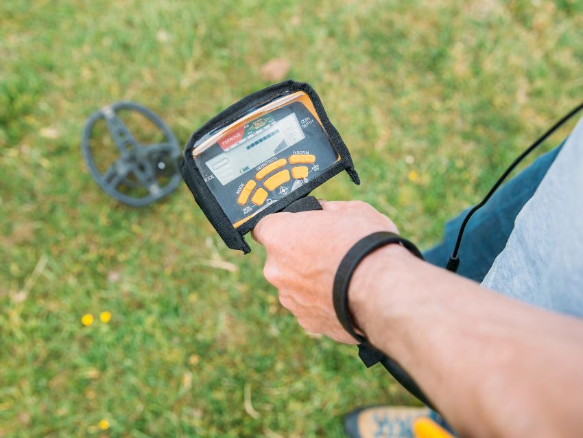 Closeup of a hand holding metal detector