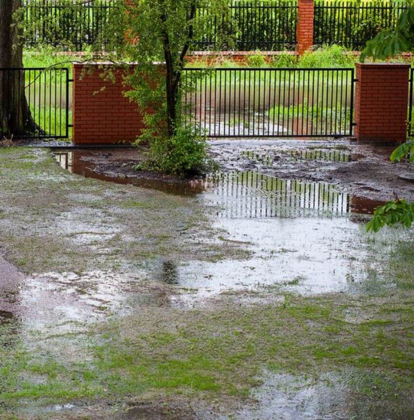 Water flooded yard with sludge and mud